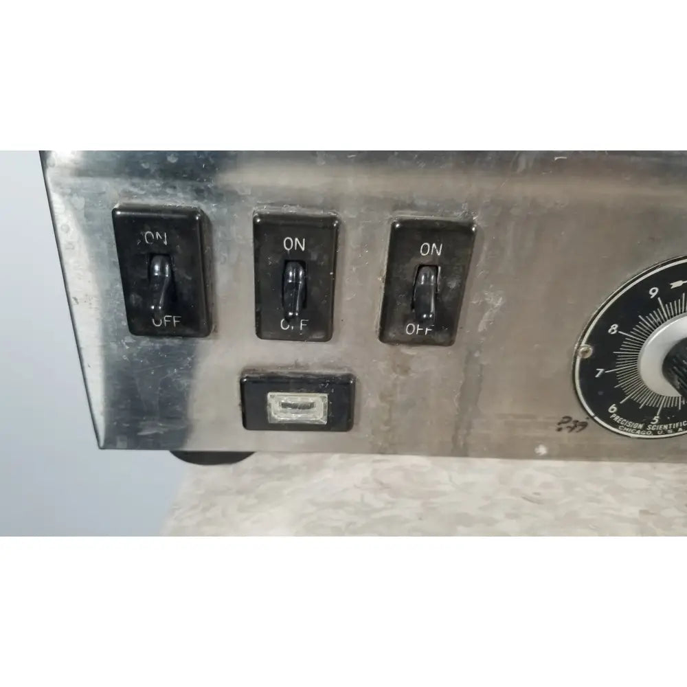 Stainless steel control panel with three black toggle switches and circular dial on precision scientific metabolic shaking incubator 66722