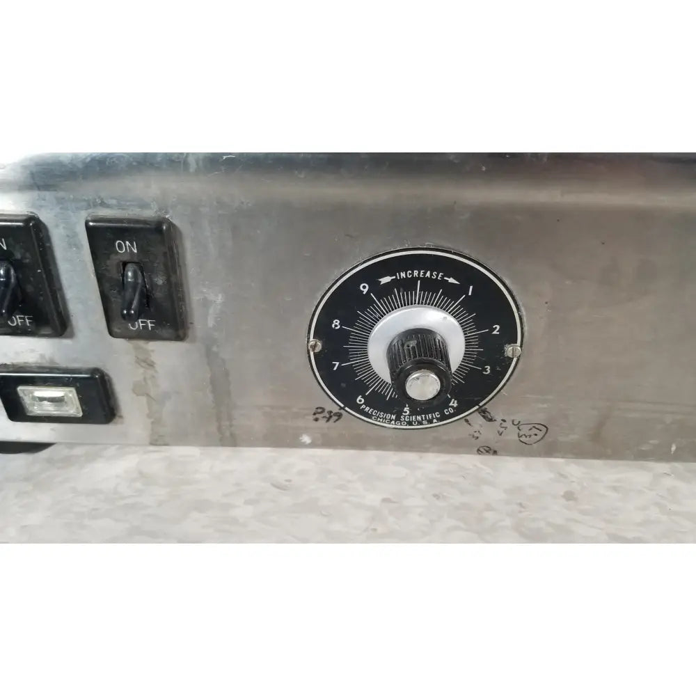 Black rotary dial with white markings on metallic surface of precision scientific metabolic shaking incubator 66722
