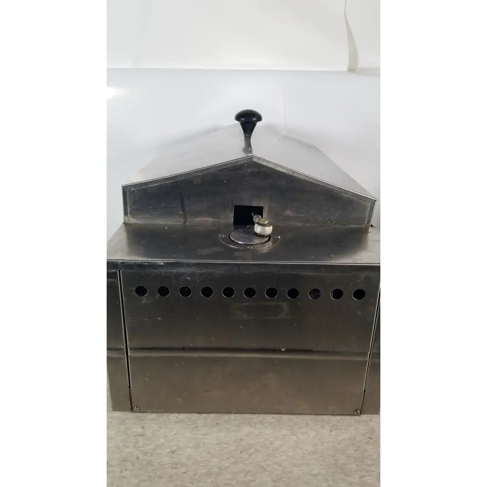 Precision scientific metabolic shaking incubator featuring an industrial stainless steel coffee roaster with black handle and ventilation holes