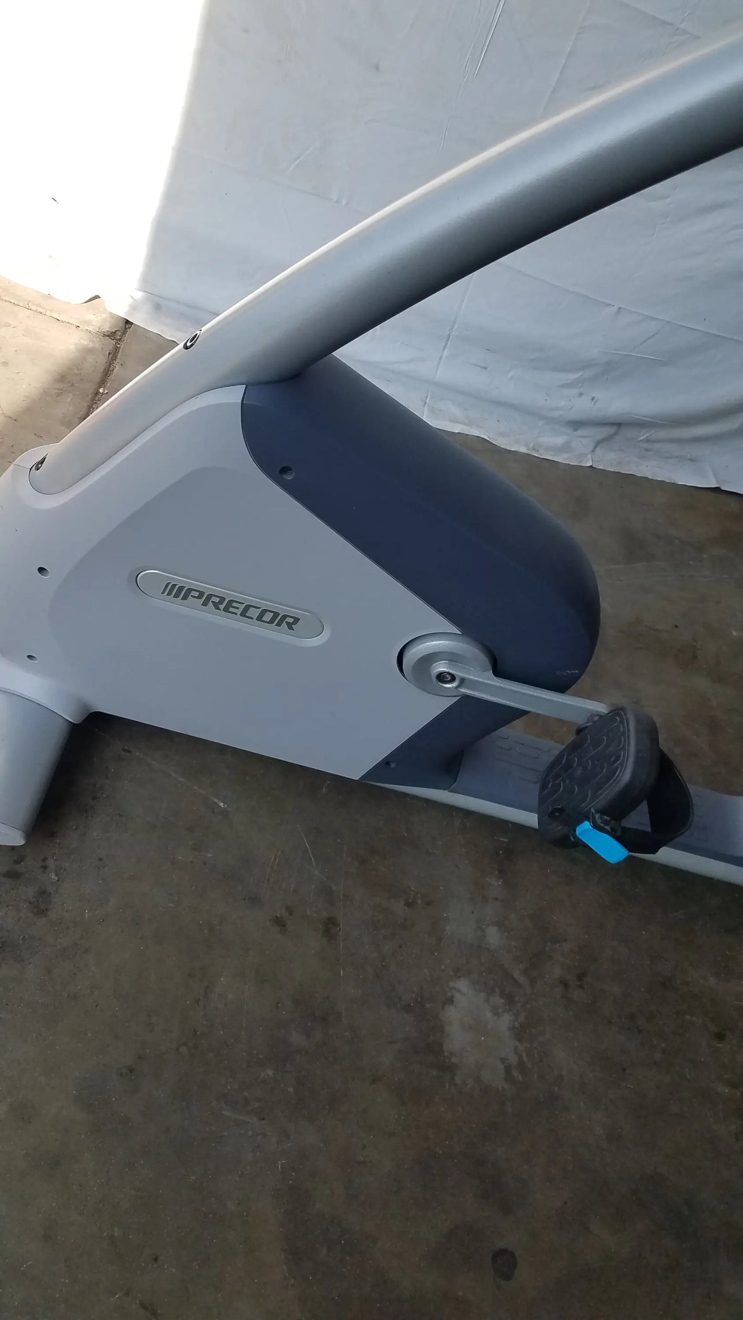 Gray and black precor recumbent exercise bike with sleek modern design featuring precor console for advanced workouts