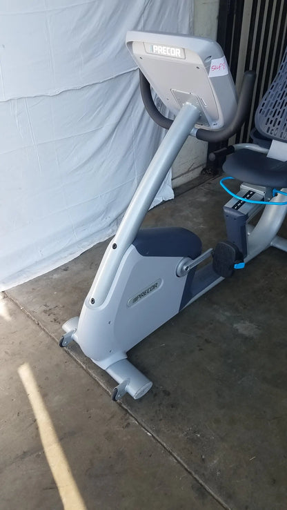 Gray and black precor recumbent exercise bike with precor console digital display panel for recumbent exercise