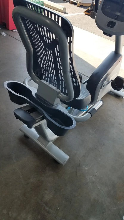 Gray and black precor recumbent exercise bike with precor console adjustable seat perforated backrest and cup holders