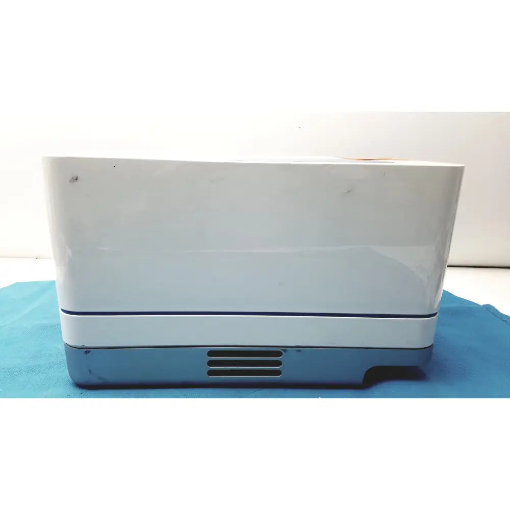 White and gray rectangular proteinsimple wes analyzer with glossy finish and thin blue accent line near the top