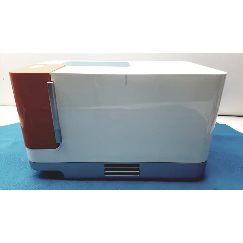 Proteinsimple Wes analyzer system compact white and red microwave with silver handle blue base and vented front panel
