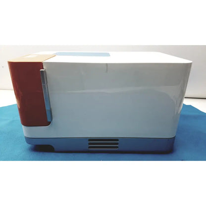 Proteinsimple Wes analyzer system compact white and red microwave with silver handle blue base and vented front panel