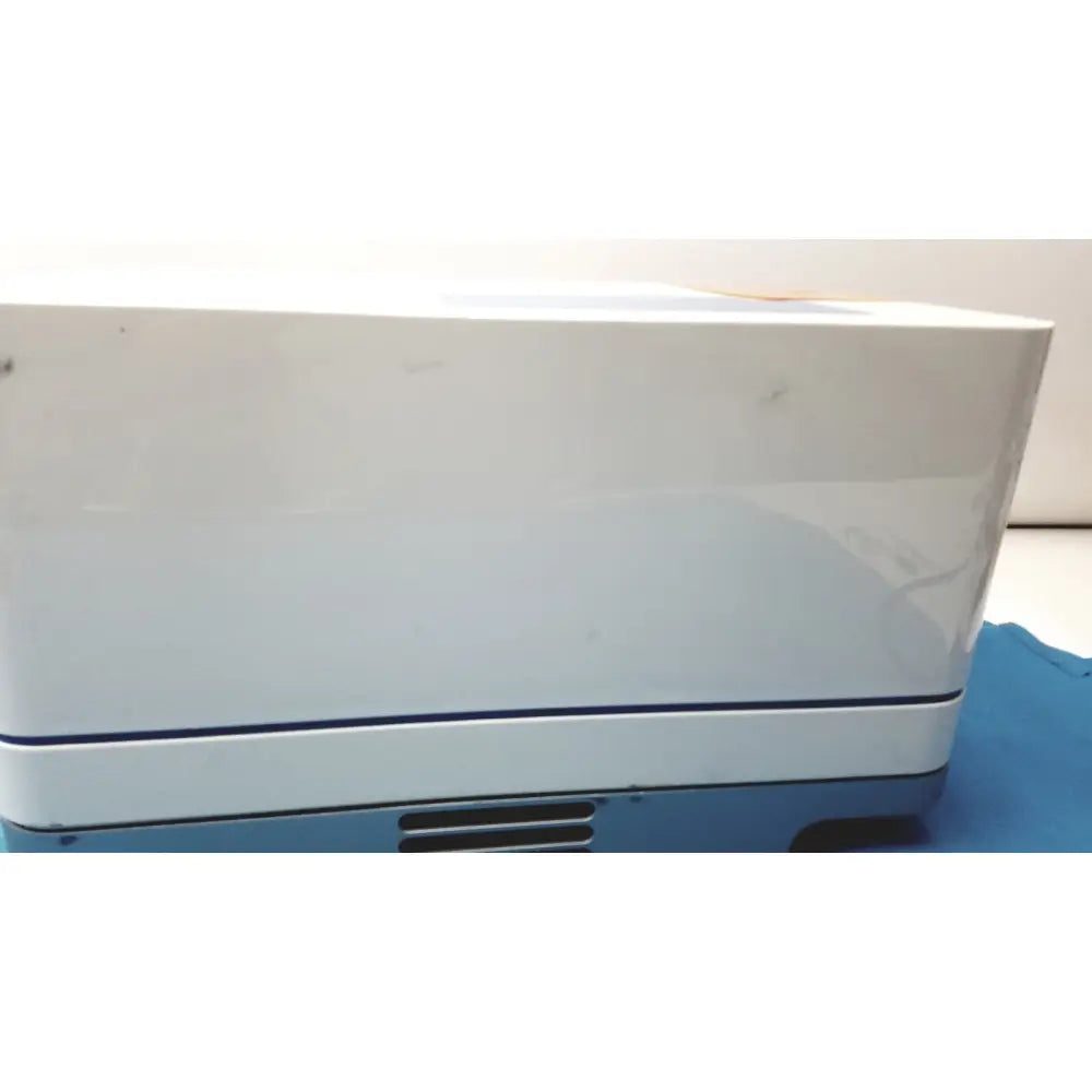 White and blue rectangular printer with glossy finish in the ProteinSimple Wes Analyzer system for protein analysis