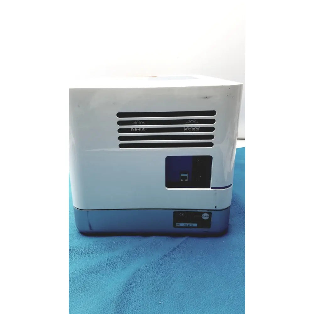 White and gray Proteinsimple Wes analyzer desktop printer with black ventilation grille on front for Wes analyzer use