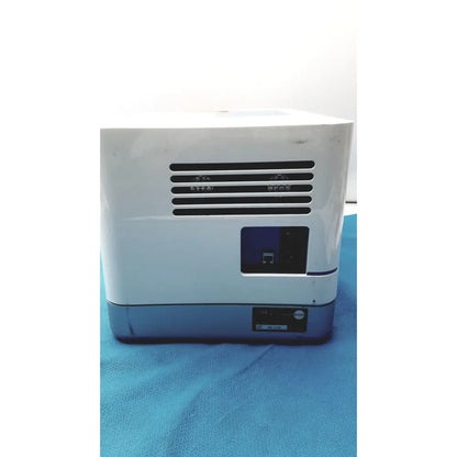 White and gray Proteinsimple Wes analyzer desktop printer with black ventilation grille on front for Wes analyzer use
