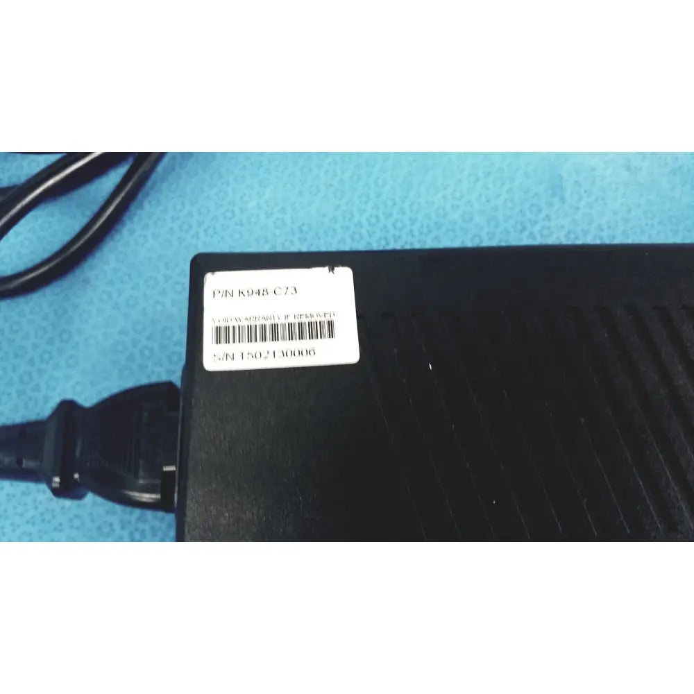 Black plastic protek power model pmp60-12-b16 ac adaptor with barcode label and attached black cable