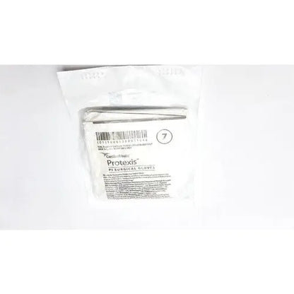 A package of sterile white Protexis surgical glove 2d72pt70x size 7 with barcode and product information visible