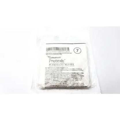 A white sterile package of cardinal health protexis pi surgical glove 2d72pt70x size 7 for medical use