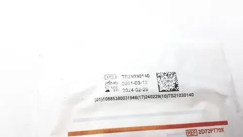 White plastic packaging of protexis pi surgical glove 2d72pt70x size 7 with barcode serial numbers and date codes visible