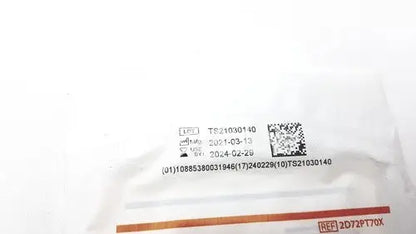 White plastic packaging of protexis pi surgical glove 2d72pt70x size 7 with barcode serial numbers and date codes visible