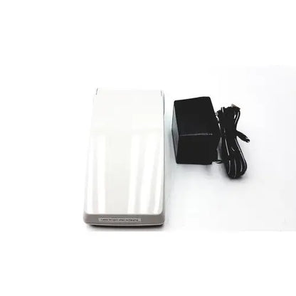 White rectangular wireless charging pad with gray trim for protime ivd microcoagulation system device
