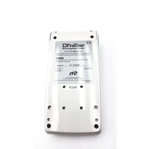 White plastic protime microcoagulation system device l11-01-01 with black screw holes and model v-12055 label for reuse medical use
