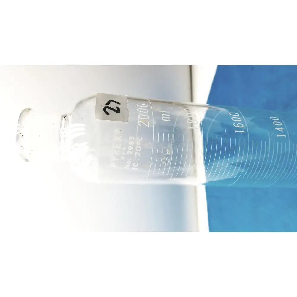 Clear glass Pyrex 2000ml graduated cylinder with milliliter markings and borosilicate glass for accurate lab measuring