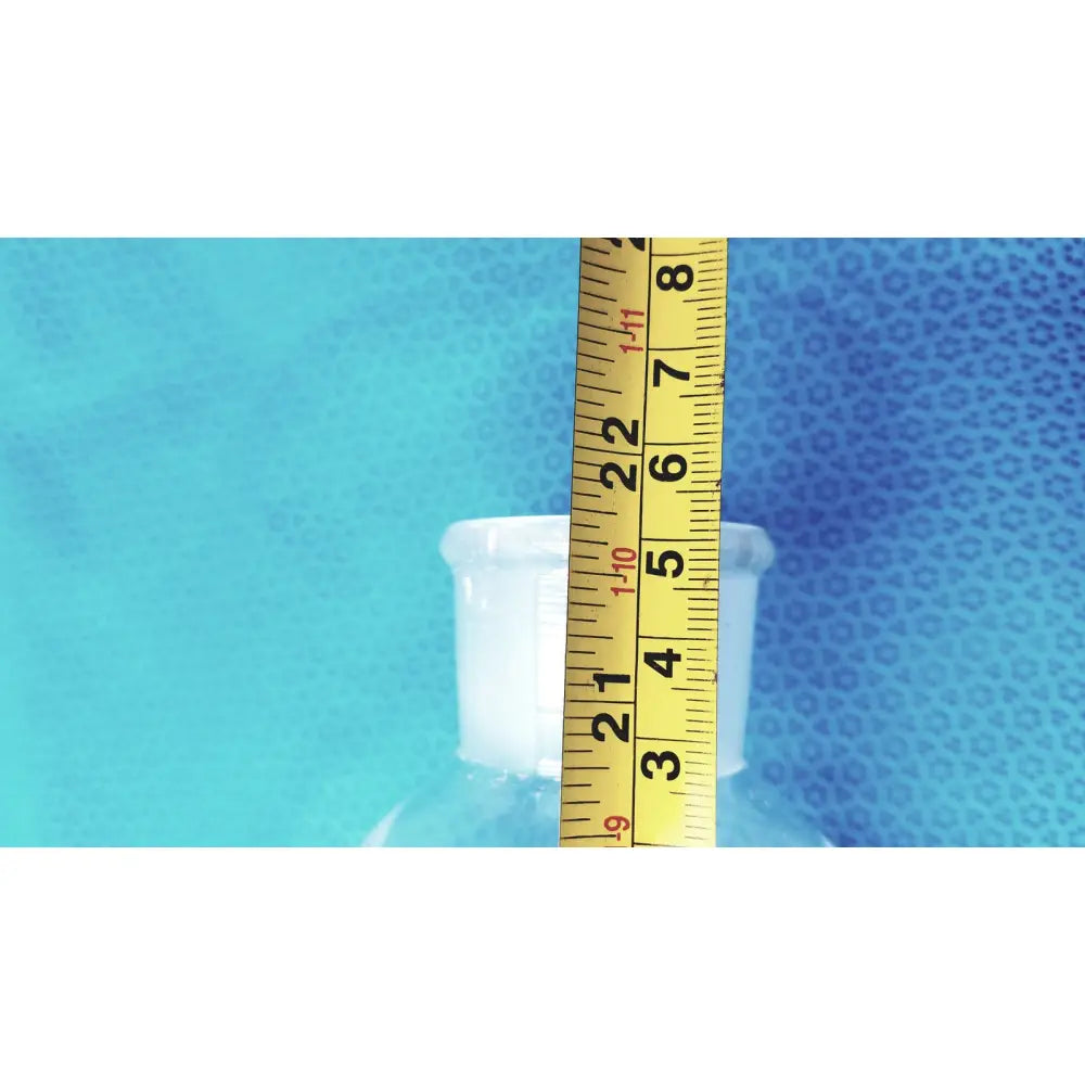 A clear plastic pyrex 2000ml graduated cylinder with white cylindrical neck made of borosilicate glass for lab use