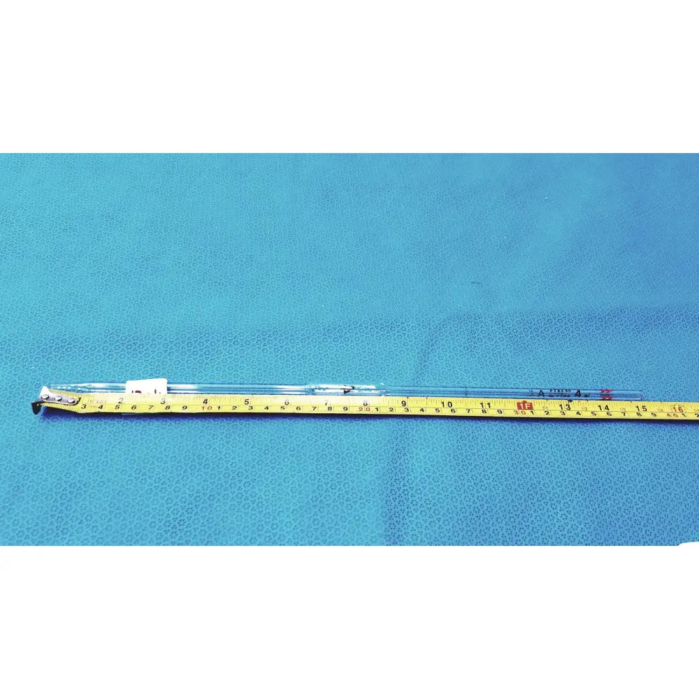 Clear pyrex 4ml class a glass graduated cylinder with black markings and white cap on yellow measuring tape