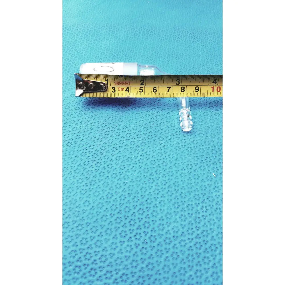Clear glass pyrex glass adapter with white cap and small transparent plastic component for right-angle tubing connection