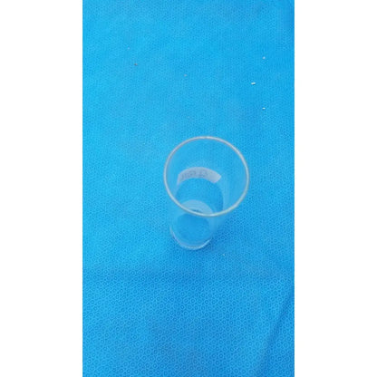 Clear plastic pyrex ground glass drinking glass with smooth cylindrical shape and tapered sides for lab use