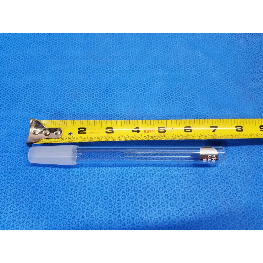 Clear glass pyrex ground glass joint test tube with translucent white cap and silver metal band for laboratory use