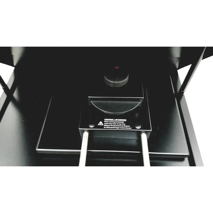 Black industrial-grade laser engraving machine with metallic parts and warning label for pyrosequencing psq96 analysis