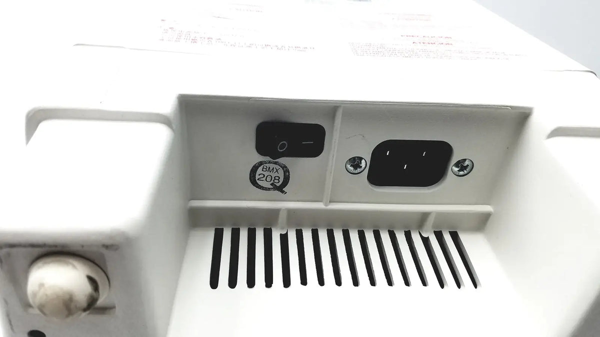 Back view of white plastic qsonica c75t ultrasonic cleaner with black power switch ac power inlet and bmx 208 sticker