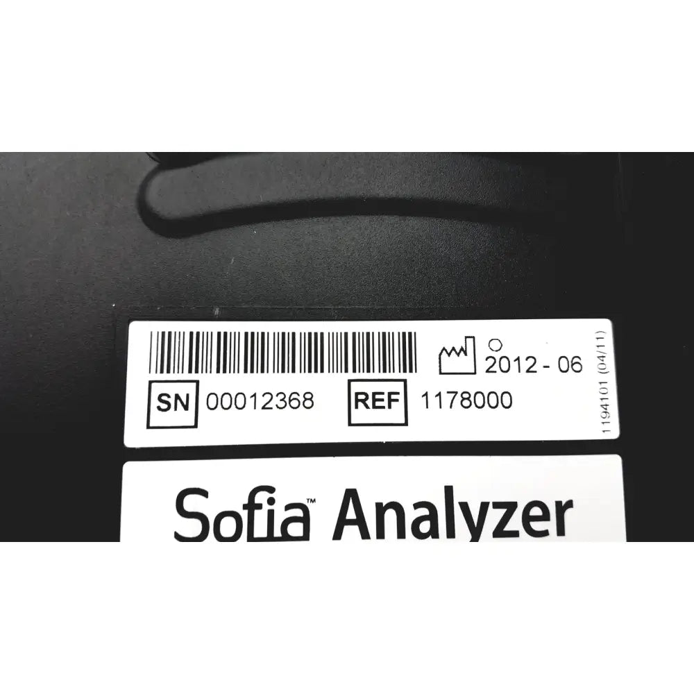 Black quidel sofia laboratory analyzer with white label showing serial number reference code and date on back side