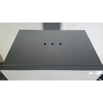 Black textured top panel with three circular holes on gray quincy lab 30gc gravity convection lab oven cabinet