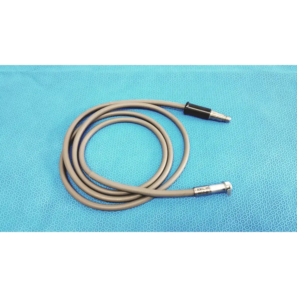 Gray flexible r wolf 8064.40 fiberoptic light cable with black and silver metallic connectors for surgical illumination