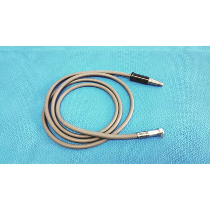 Gray flexible r wolf 8064.40 fiberoptic light cable with black and silver metallic connectors for surgical illumination