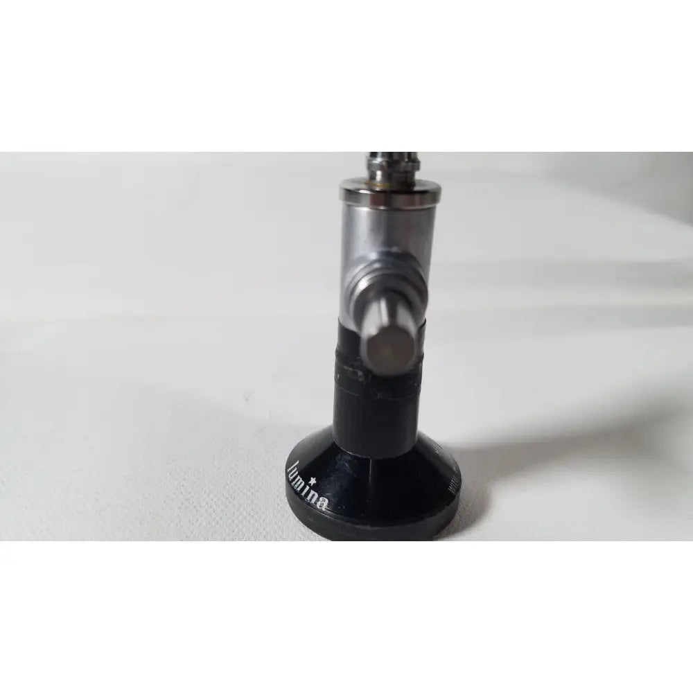 Black and silver metallic gas regulator with circular base engraved lumina for r wolf 8471.42 25 degree rigid arthroscope