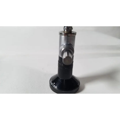 Black and silver metallic gas regulator with circular base engraved lumina for r wolf 8471.42 25 degree rigid arthroscope