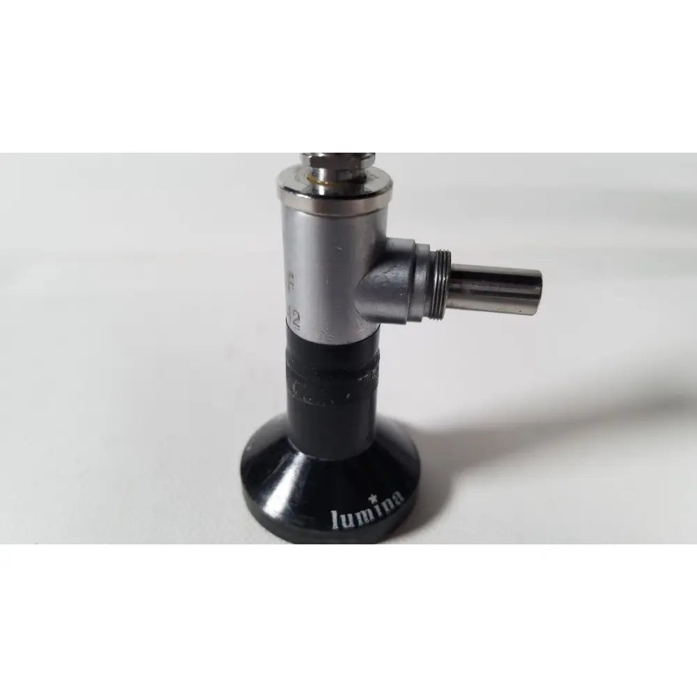 Black and silver luminia gas burner with cylindrical metallic body and threaded nozzle for reuse medical degree rigid arthroscope use