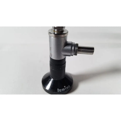 Black and silver luminia gas burner with cylindrical metallic body and threaded nozzle for reuse medical degree rigid arthroscope use