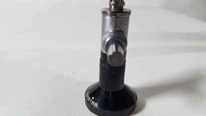 Black and silver metallic gas regulator with circular base engraved lumina for r wolf 8471.42 25 degree rigid arthroscope