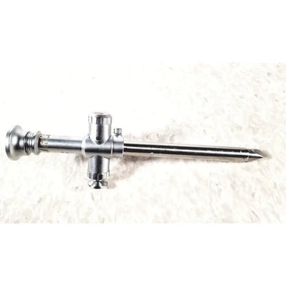 Silver metallic reuse medical trocar 10mm with cross-shaped handle and tapered tip for laparoscopic instruments by r wolf