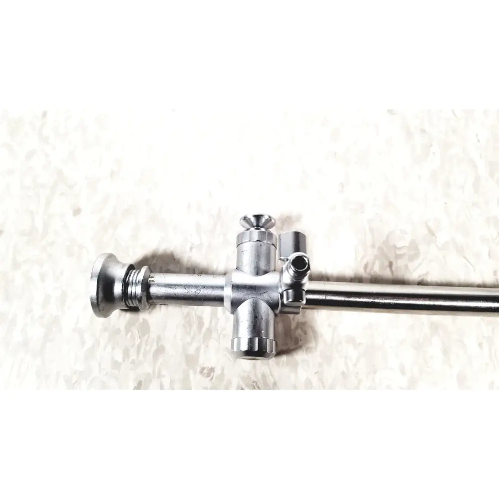 Silver metallic r wolf 8934.01 sheath with 8923.123 trocar 10mm featuring central cross junction and threaded ends for reuse medical laparoscopic instruments
