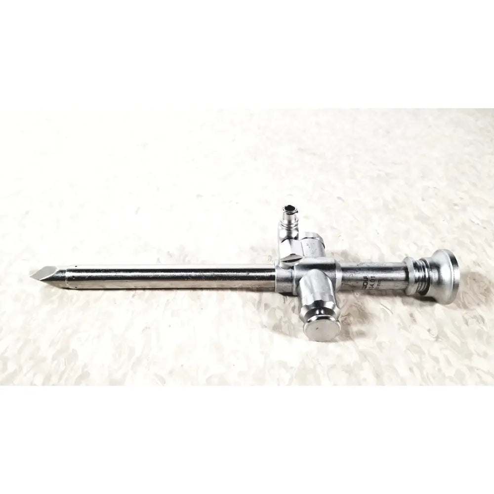 Silver surgical trocar 10mm with pointed tip and threaded connectors from r wolf reuse medical laparoscopic instruments