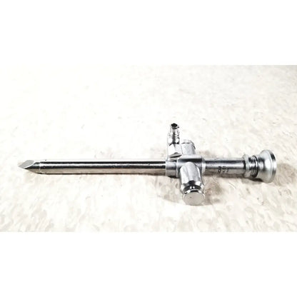 Silver surgical trocar 10mm with pointed tip and threaded connectors from r wolf reuse medical laparoscopic instruments