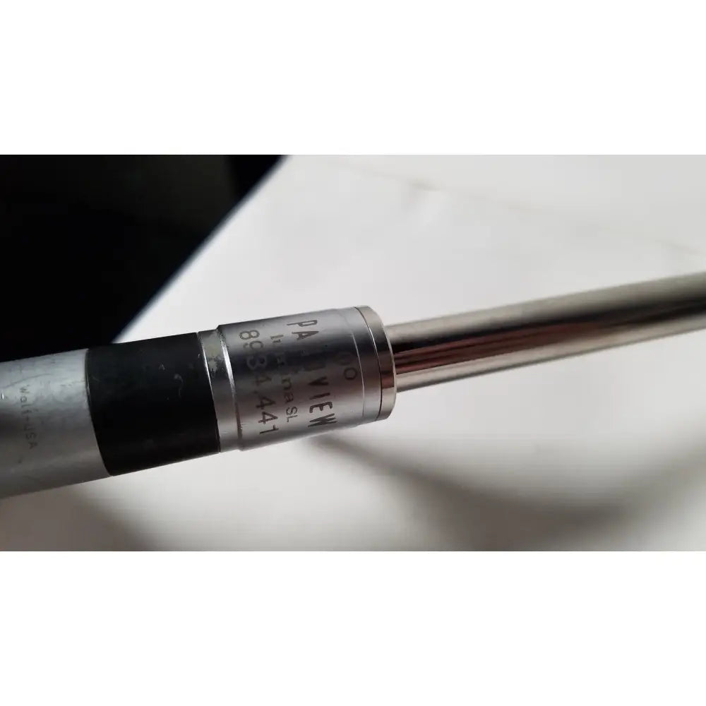 Silver cylindrical degree rigid lumina micrometer with black grip and panaview 10mm engraving on metallic body