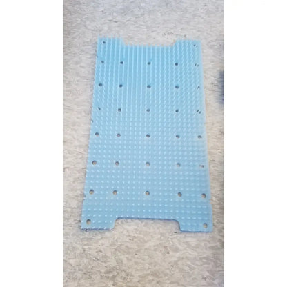 Light blue silicone radionics surgical sterlization case tray with raised dot grid and circular holes for surgical sterlization