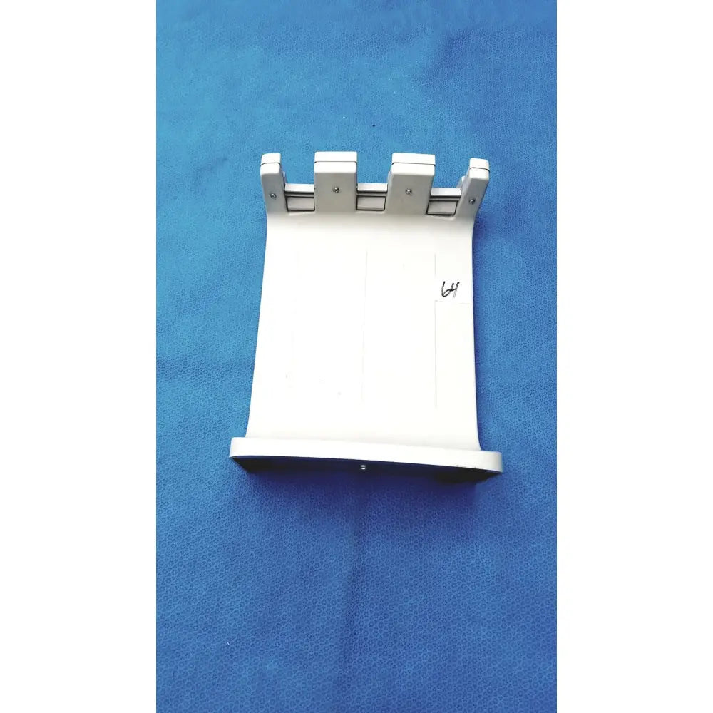 White plastic mounting bracket with four silver metal clips for rainin e3 rapid charge stand accessory