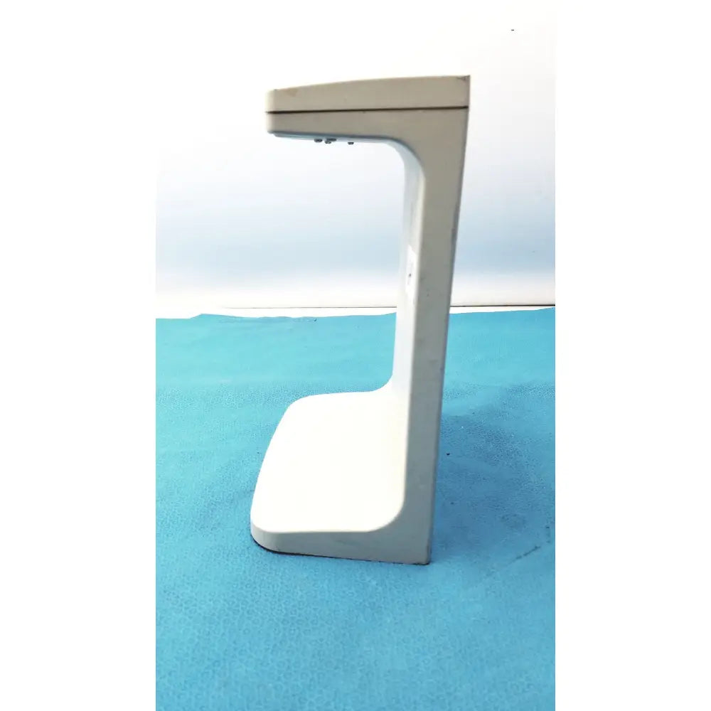 A sleek white plastic rainin e3 rapid charge stand with a minimalist curved design for rapid charge use