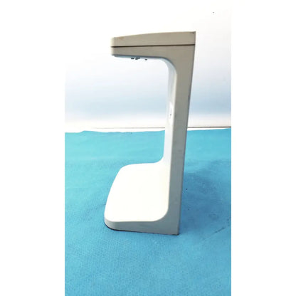 A sleek white plastic rainin e3 rapid charge stand with a minimalist curved design for rapid charge use