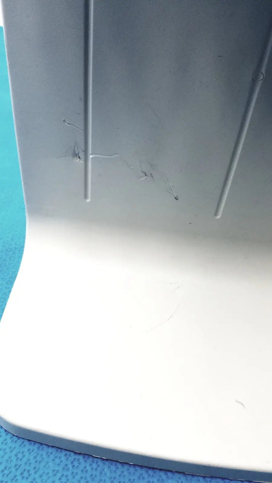 Gray plastic base with vertical ridges and minor scratches of rainin e3 rapid charge stand product back side