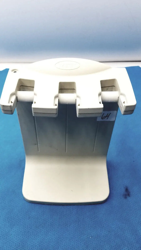 Off-white plastic dental handpiece holder with three adjustable slots for rainin e3 rapid charge stand rapid charge use