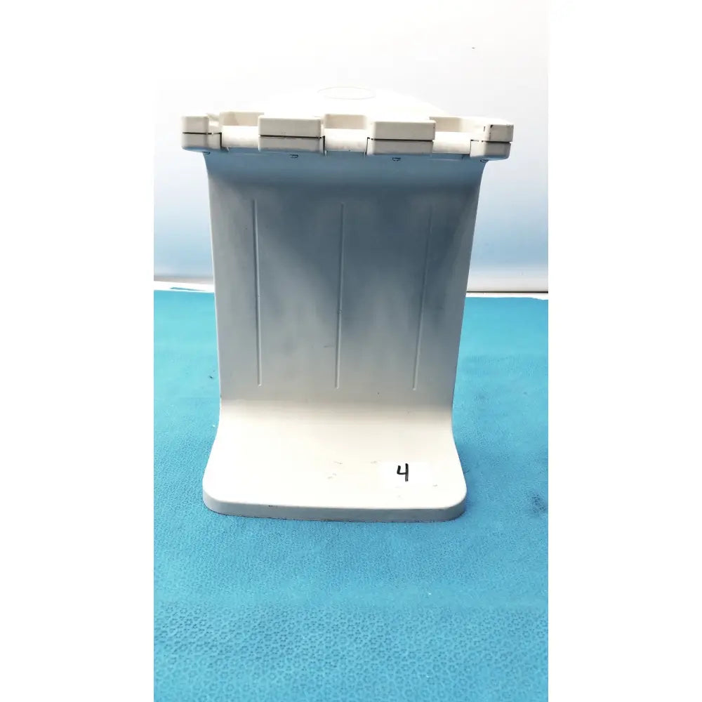White plastic rainin e3 rapid charger stand with ribbed front panel and segmented top lid for efficient charging