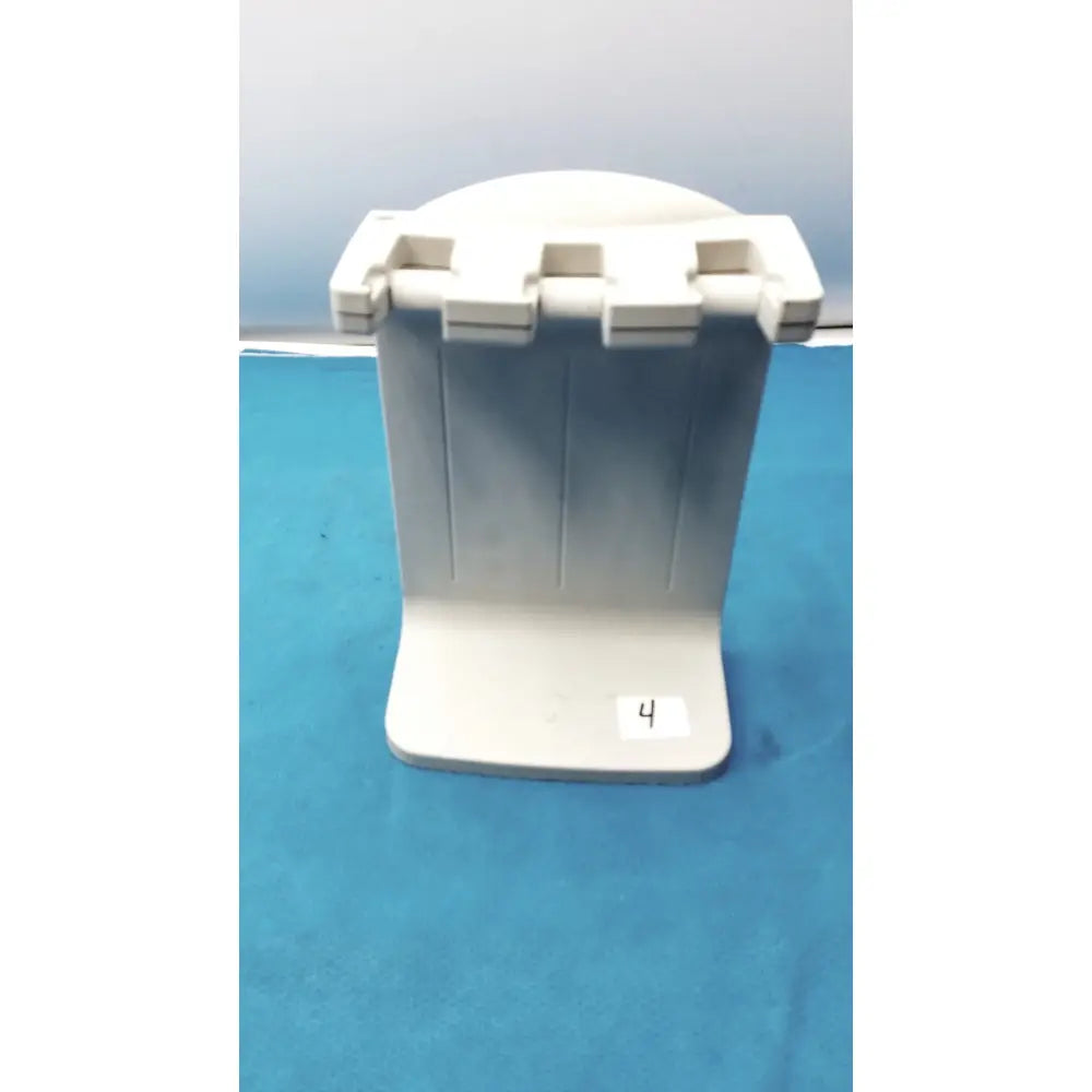 White plastic Rainin E3 Rapid rapid charger stand with three vertical slots for holding books or devices