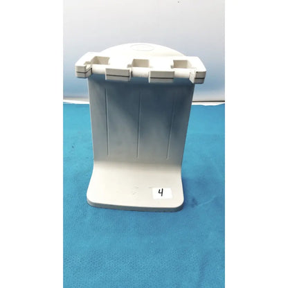 White plastic toothbrush holder with four slots and vertical ridges for the Rainin E3 Rapid charger stand